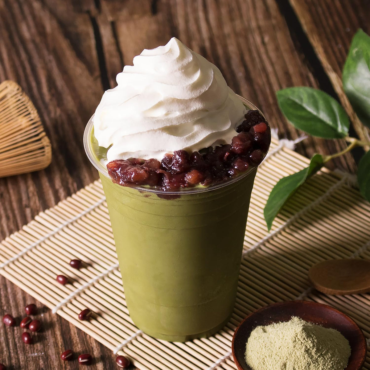 Pouring Tea Zone matcha powder into milk tea for smooth blend