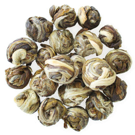 Close-up of Jasmine Pearls loose-leaf tea highlighting premium quality leaves