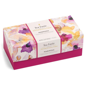 Tea Forte pyramid infuser close-up, handcrafted leaves unfurling for rich aroma.