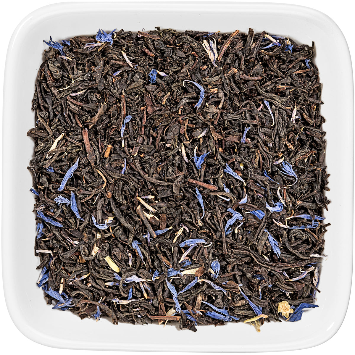 Warm cup of Cream Earl Grey Moonlight beside a vanilla bean
