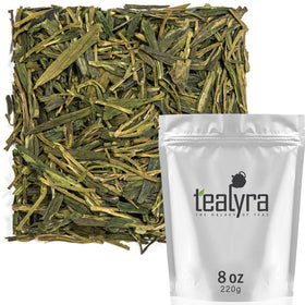 Tealyra Dragon Well loose tea with flat large leaves, ideal for a refined brew.