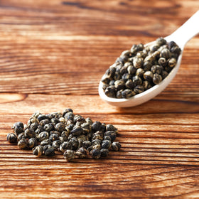 Tealyra Imperial Jasmine Dragon Pearls brewed cup ready to enjoy with a gentle aroma.