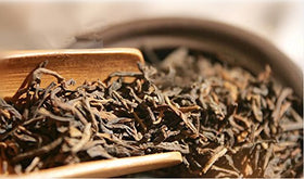 Tealyra Ripe Pu'erh tea brewed cup showing bold flavor and caffeine.