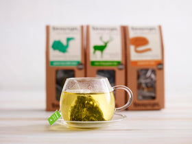 Steaming cup of Teapigs Green Tea with Mint, refreshing aroma.