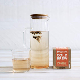 Close-up of peach and mango fruit in Teapigs blend with hibiscus hints.