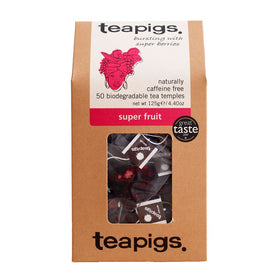 Teapigs Super Fruit Tea box showcasing whole cranberries and blueberries for natural flavor