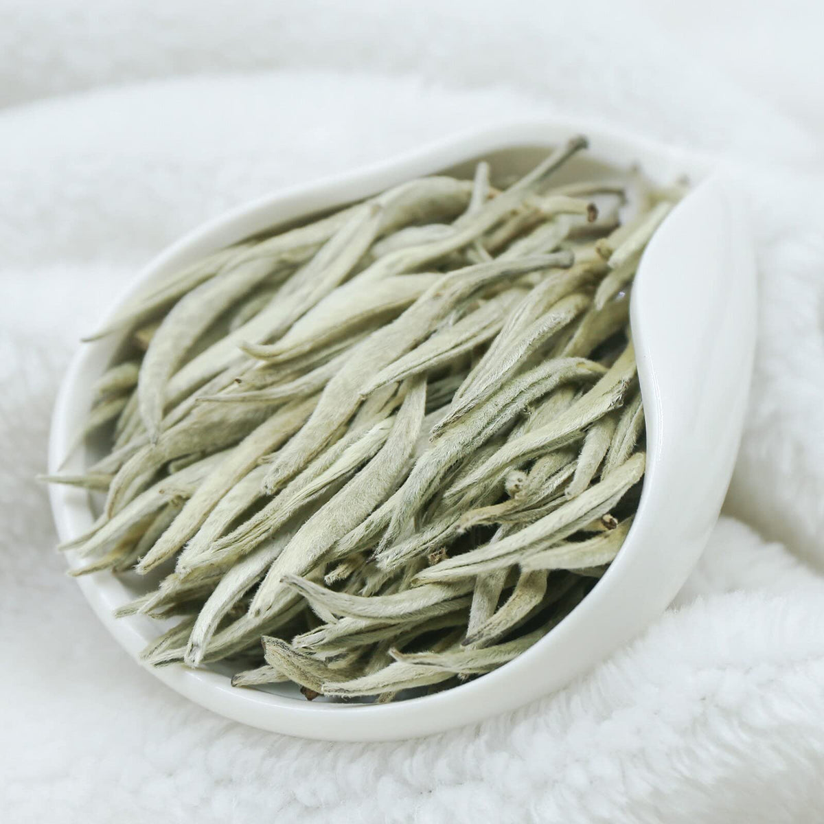 TEARELAE Bai Hao Yin Zhen dawn-picked buds showcased as premium loose tea.