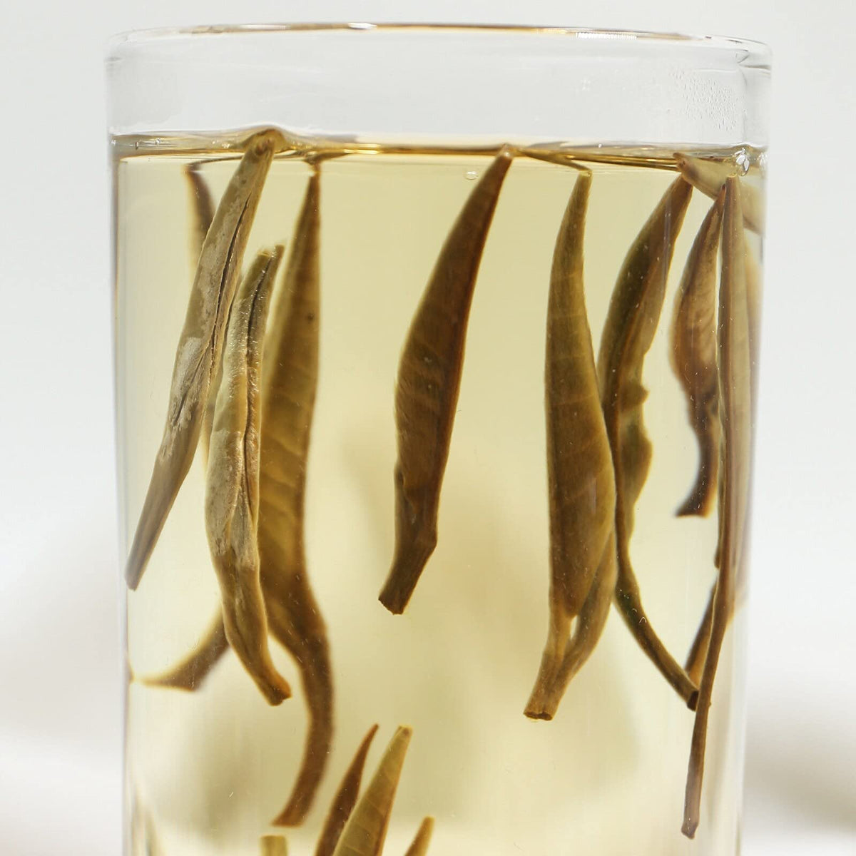 TEARELAE brewed cup reveals apricot-yellow tea with subtle sweetness.
