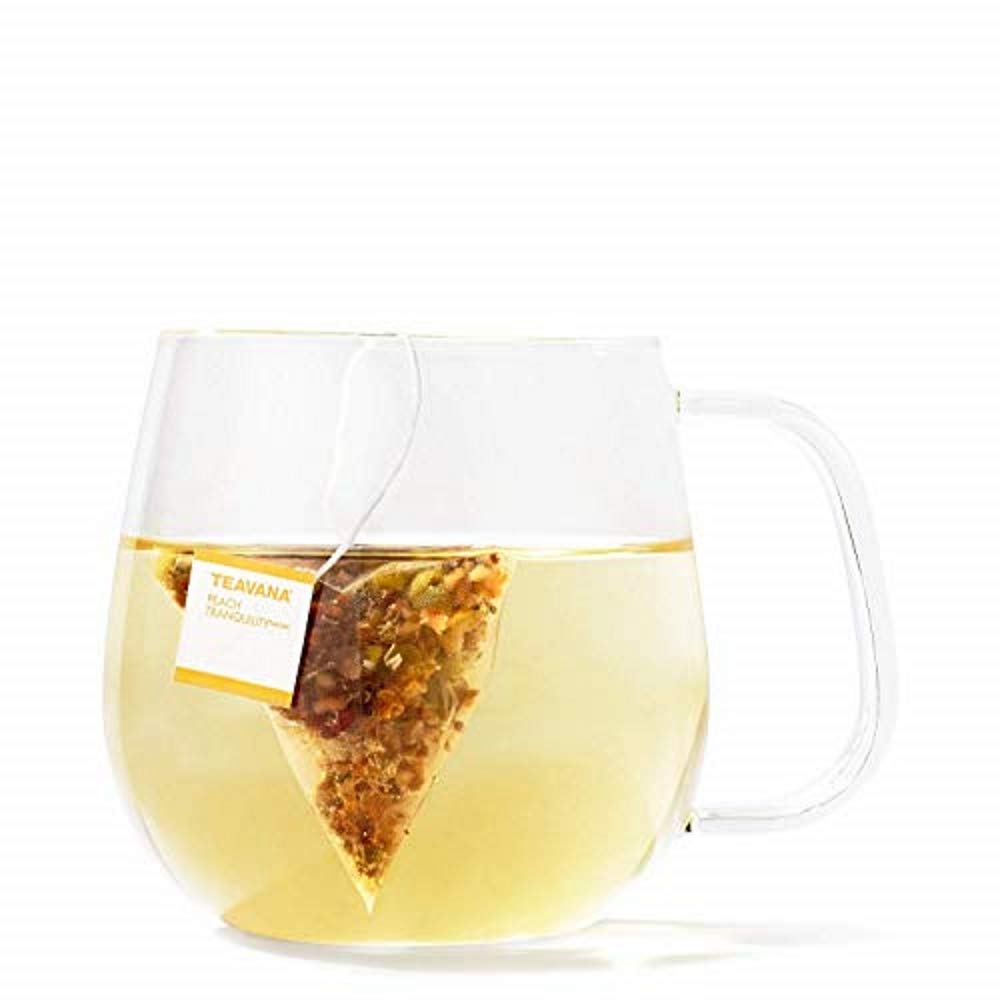 Teavana Peach Tranquility sachets with a tea cup steeping for a fragrant, relaxing break.