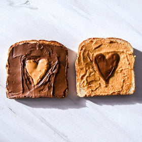 Teddie peanut butter spread on toast with chunky texture.