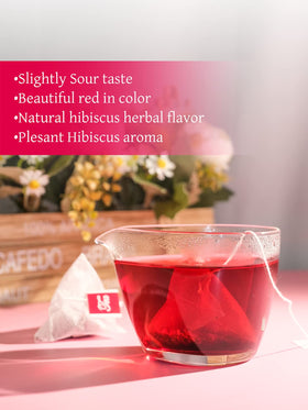 TeeLux hibiscus tea bags closeup with dried flowers shows vibrant color and natural flavor
