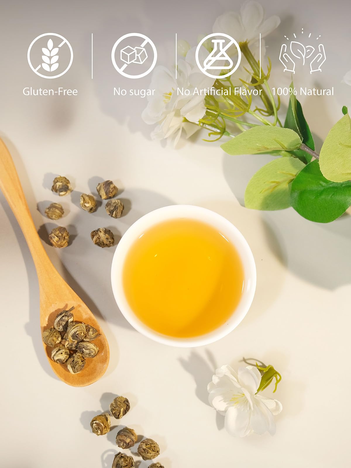 Steam rising from steeping Jasmine Pearls reveals a gentle aroma.