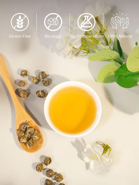 Steam rising from steeping Jasmine Pearls reveals a gentle aroma.
