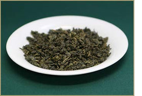Ten Ren King's 103 Green Ginseng Oolong in a cup, ideal for a relaxing tea moment