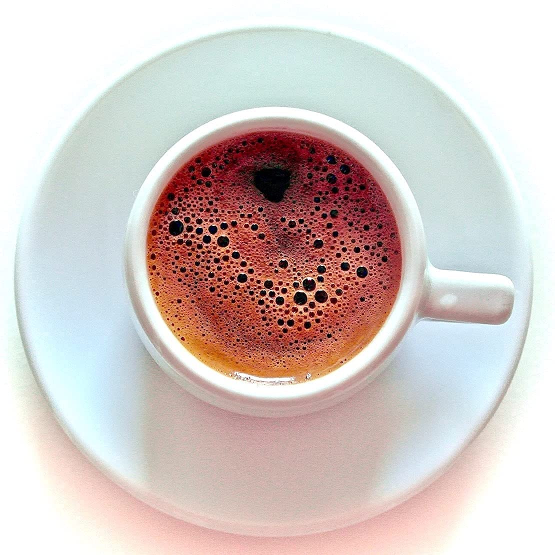 Terra Creta Bravo Greek Ground Coffee 2-pack foam-cup shows crema-rich pour.