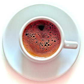 Terra Creta Bravo Greek Ground Coffee 2-pack foam-cup shows crema-rich pour.