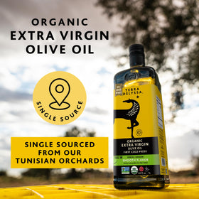 Terra Delyssa olive oil being poured, ideal for salads and dipping.
