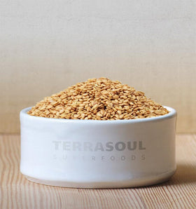 Terrasoul Golden Flax Seeds spill on counter, raw gluten-free grains
