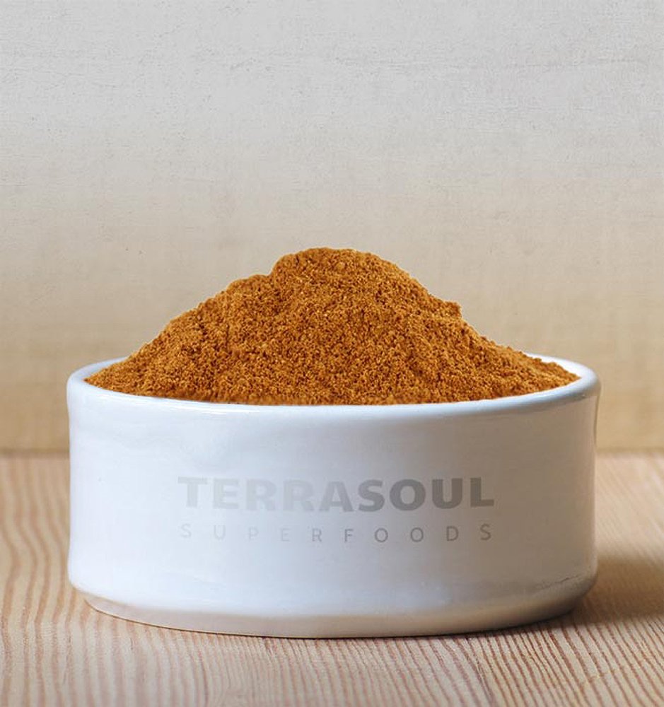 Closeup of Terrasoul Mangosteen powder texture, showcasing raw organic quality.