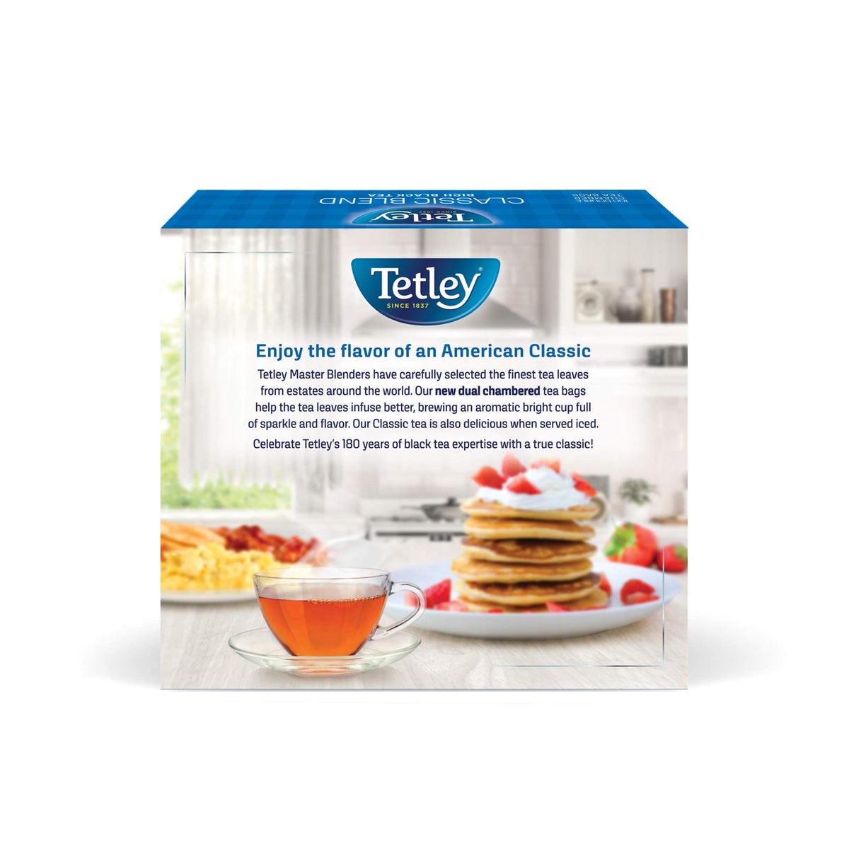 Tetley Classic Blend pouring teacup, steam rising for a cozy moment.