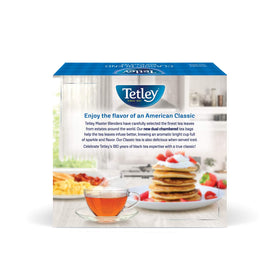 Tetley Classic Blend pouring teacup, steam rising for a cozy moment.