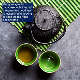 Tetley Green Tea cup with steam suggesting a refreshing hot drink.