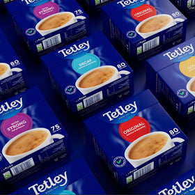 Rainforest Alliance badge on Tetley packaging indicating ethical sourcing.