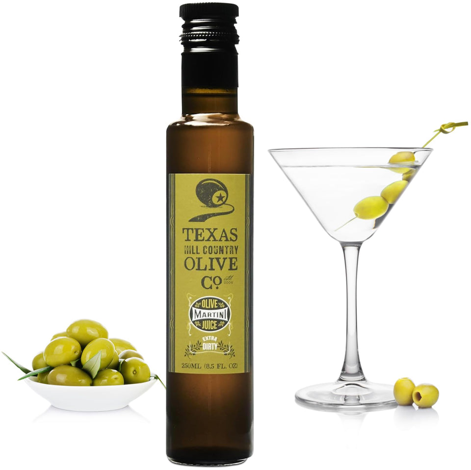 Texas Hill Country Olive Co. Extra Dirty Martini Olive Juice bottle with pour for bold cocktails