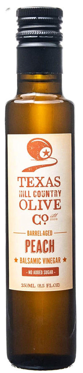 Texas Hill Country Olive Co. Peach Balsamic bottle for versatile dressings and glazes.