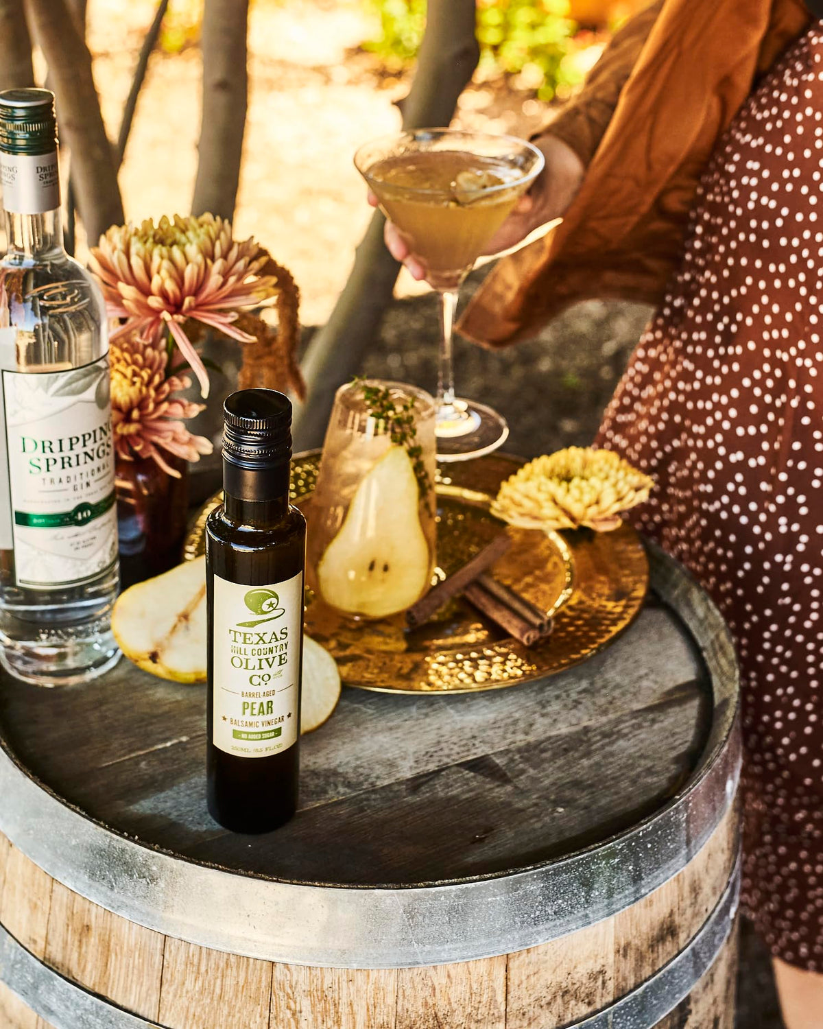 Texas Hill Country Olive Co. pear balsamic dressing pour enhances greens with fruity tartness