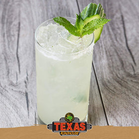 Texas Roadhouse margarita glass highlights vibrant color and rim salt.