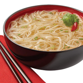 Thai Kitchen microwave-ready meal cup shown for quick, easy heating.