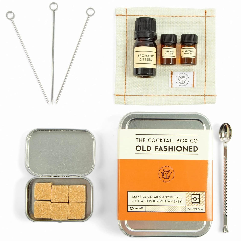 The Cocktail Box Co. old fashioned kit compact plane setup for travel-ready cocktails.