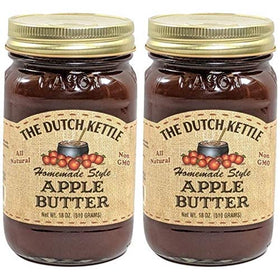 The Dutch Kettle Apple Butter jar on a rustic kitchen countertop, perfect for toast.