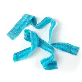 Colorful Blueberry Sour Belts arranged for a party plate by The Hampton.