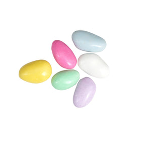 Wedding favors featuring pastel Jordan almonds and gift-ready packaging by The Hampton Candy Company.