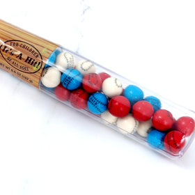 The Hampton Candy Company baseball gumballs inside a bat container for fun gifts.