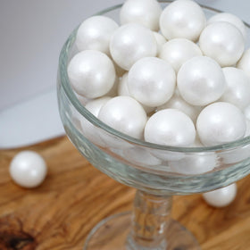 The Hampton Candy Company bubble-blowing ready white shimmer gumballs for playful events.