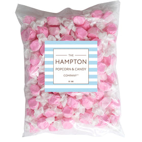 Strawberry pink taffy pieces, individually wrapped for freshness and easy gifting.