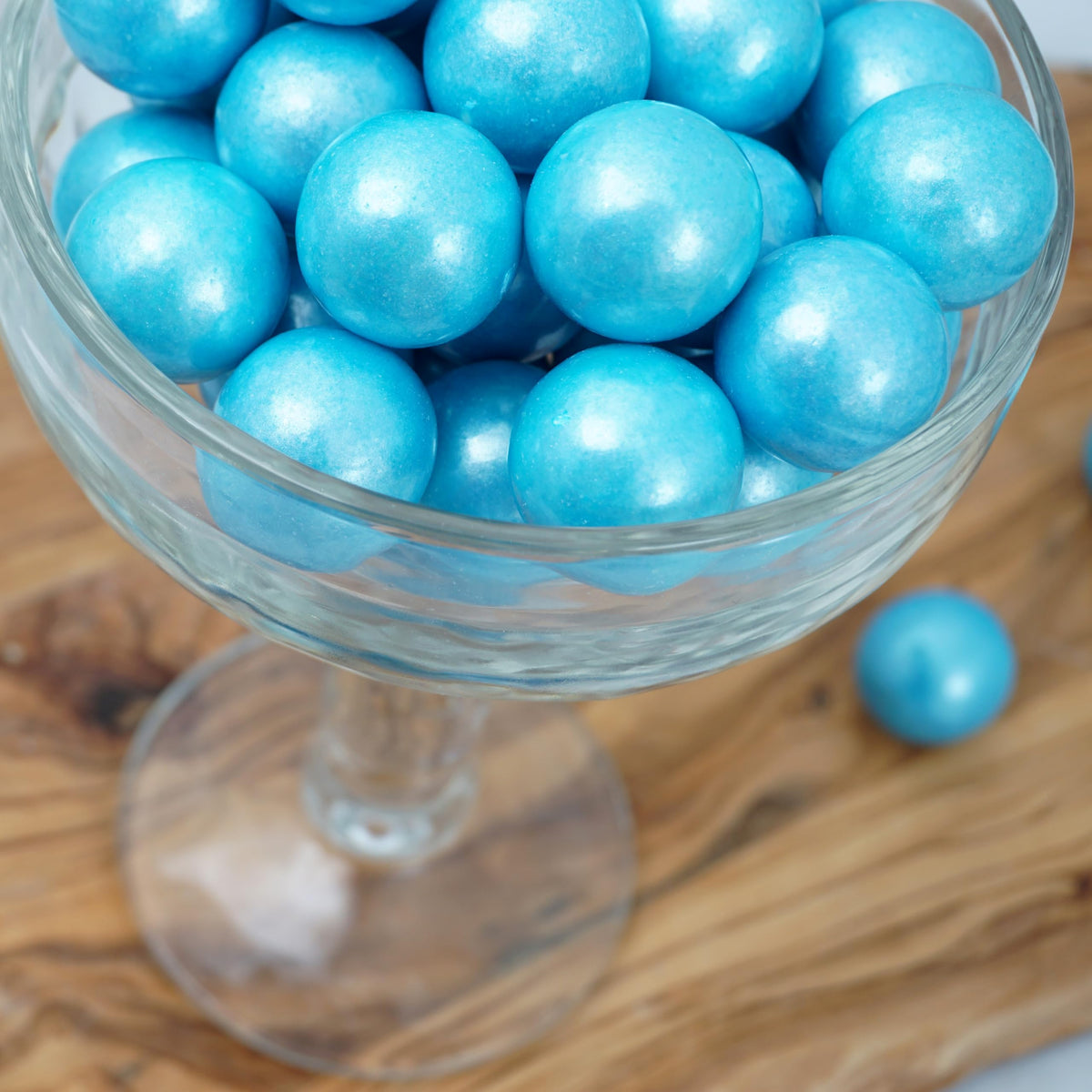 The Hampton Light Blue Shimmer Gumballs on a party table add color and fun