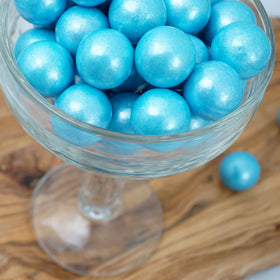 The Hampton Light Blue Shimmer Gumballs on a party table add color and fun