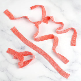 The Hampton Strawberry Sour Belts on a festive table for celebrations.