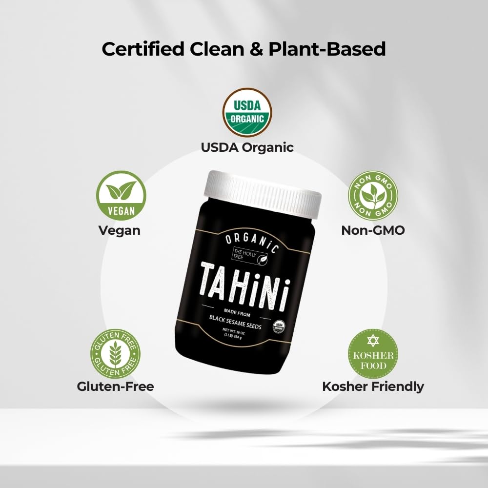 Pouring black tahini dressing made with The Holly Tree over greens.