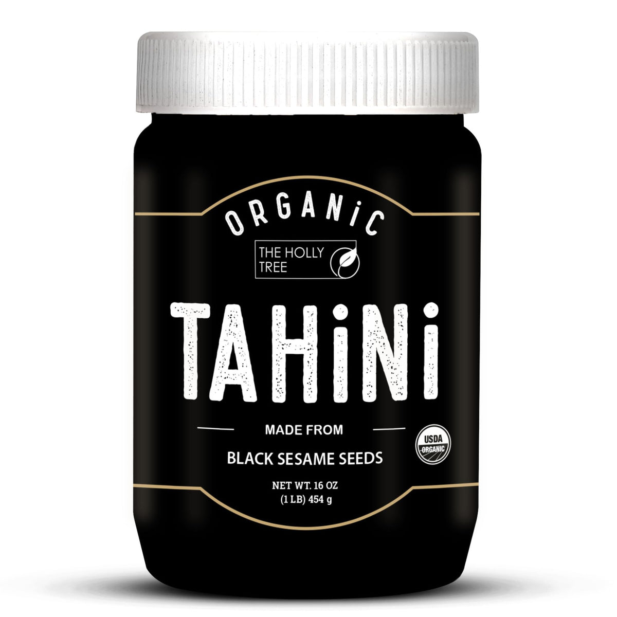 The Holly Tree Black Tahini Paste jar showing rich color and creamy texture.