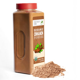 The Holly Tree Cinnamon Powder on a spice rack in a cozy kitchen.