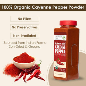 Close-up of The Holly Tree cayenne pepper powder being sprinkled for bold flavor.