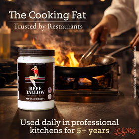 The Lady May grass-fed beef tallow bottle on the stove for high-heat cooking.