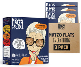 The Matzo Project Crispy Matzo Flats on a cheese board, ideal for dips.