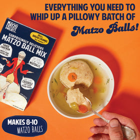 Bowl with The Matzo Project matzo ball mix dough ready to form balls