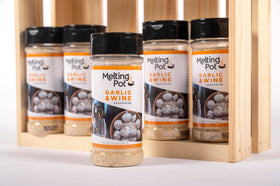 The Melting Pot garlic and wine seasoning on vegetables for enhanced taste.
